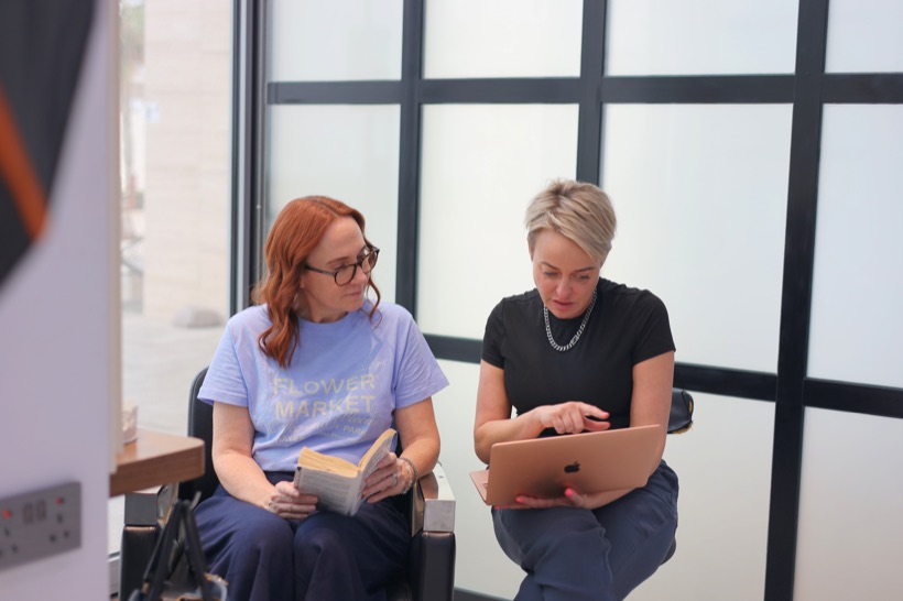 A client and stylist planning her hair together
